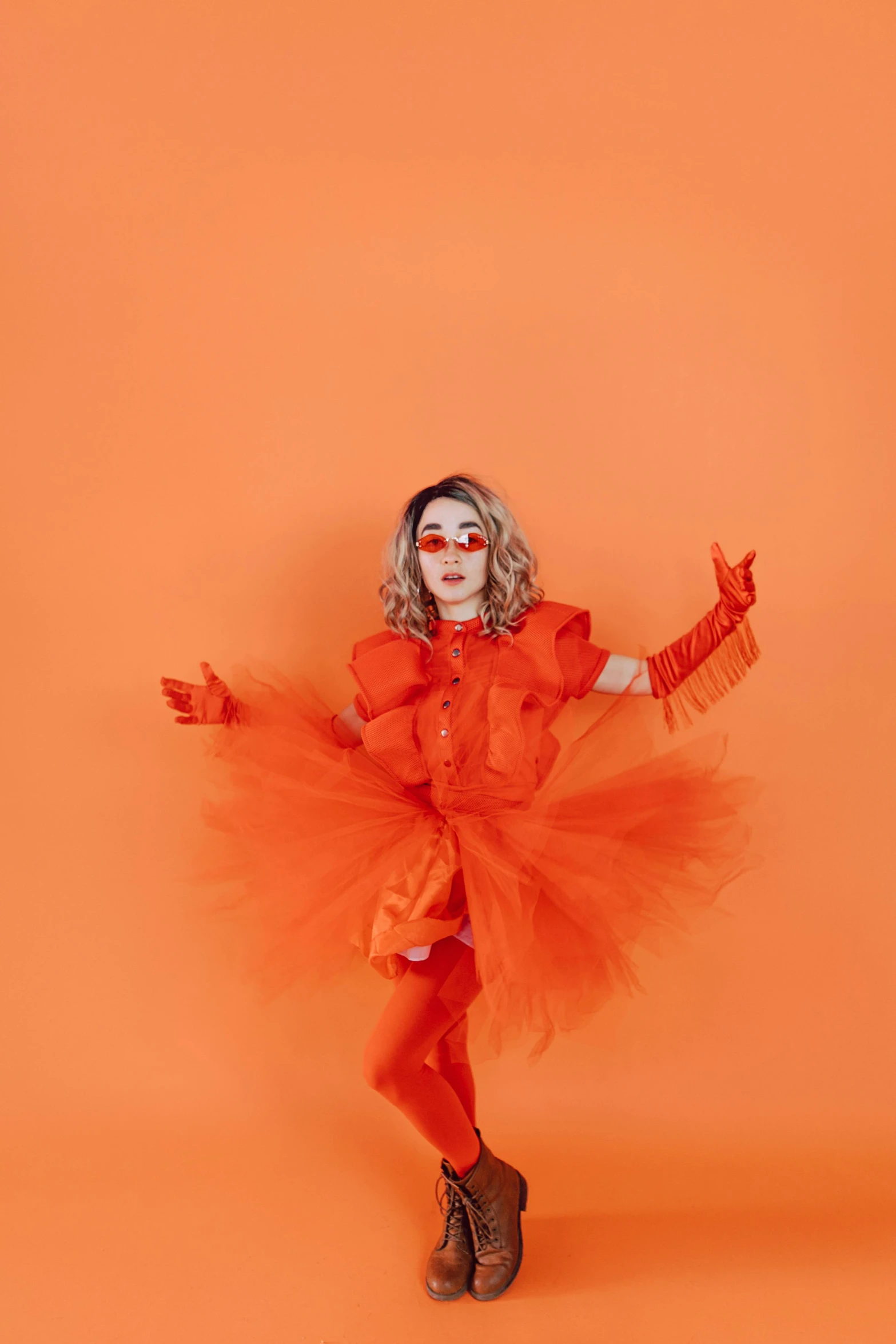 a little girl in an orange dress on an orange background, an album cover, inspired by Bert Stern, trending on pexels, antipodeans, clown, full body made of white feathers, cosplayer dressed like a crab, monochromatic red