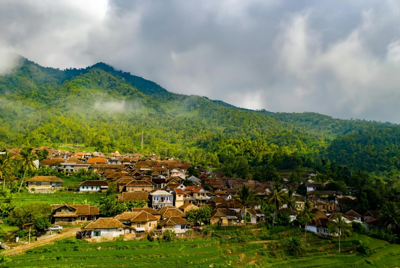 a village with a mountain in the background, pexels contest winner, sumatraism, background image, square, rolling foothills, white