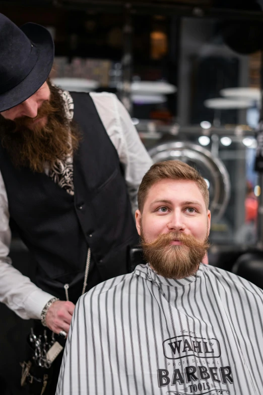 a man getting a haircut at a barber shop, a portrait, by Jaakko Mattila, trending on reddit, light stubble beard, professional product photo, really long, well-groomed model
