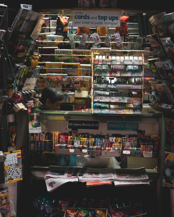 a store filled with lots of different types of goods, a screenshot, pexels contest winner, happening, stairs and bookshelves, lgbtq, newspaper, film photo