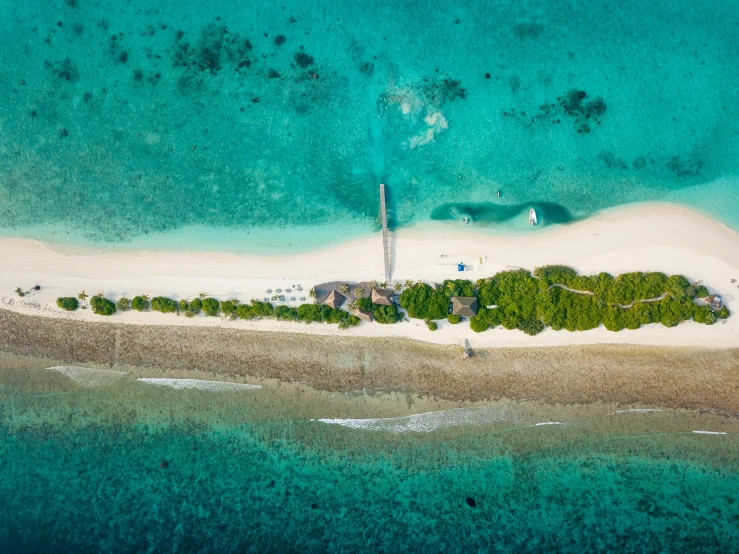 an aerial view of an island in the middle of the ocean, by Peter Churcher, pexels contest winner, hurufiyya, in a beachfront environment, sam leach, thumbnail, tiffany dover