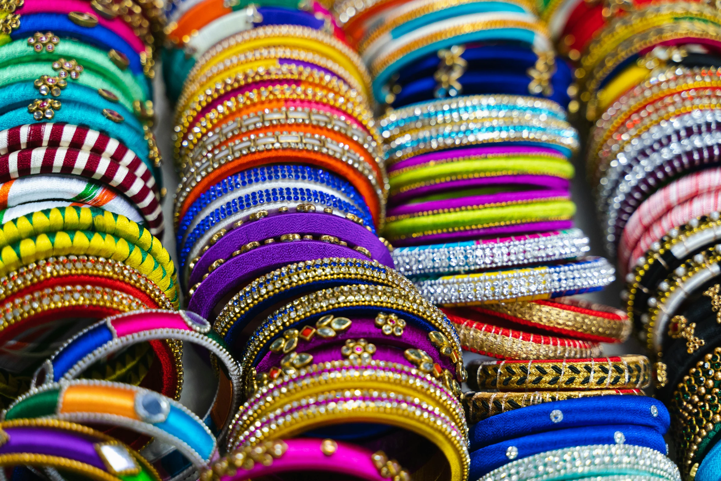 a close up of many different colored bracelets, renaissance, indian style, fan favorite, instagram post, shot on sony a 7