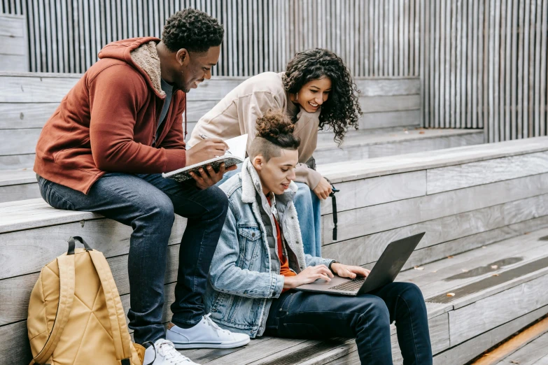 a group of people sitting on steps with laptops, trending on pexels, happening, black teenage boy, avatar image, educational, 1 2 9 7