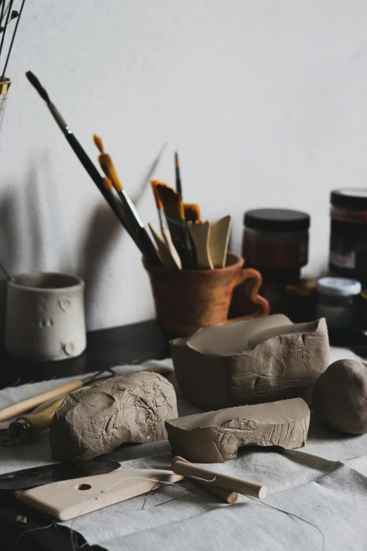 a bunch of tools sitting on top of a table, a still life, inspired by Hendrik Gerritsz Pot, trending on unsplash, arbeitsrat für kunst, made of clay, profile picture, art set, india ink