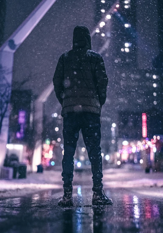 a person standing in the middle of a street at night, an album cover, pexels contest winner, full body:: snow outside::, looking over city, outlive streetwear collection, profile pic
