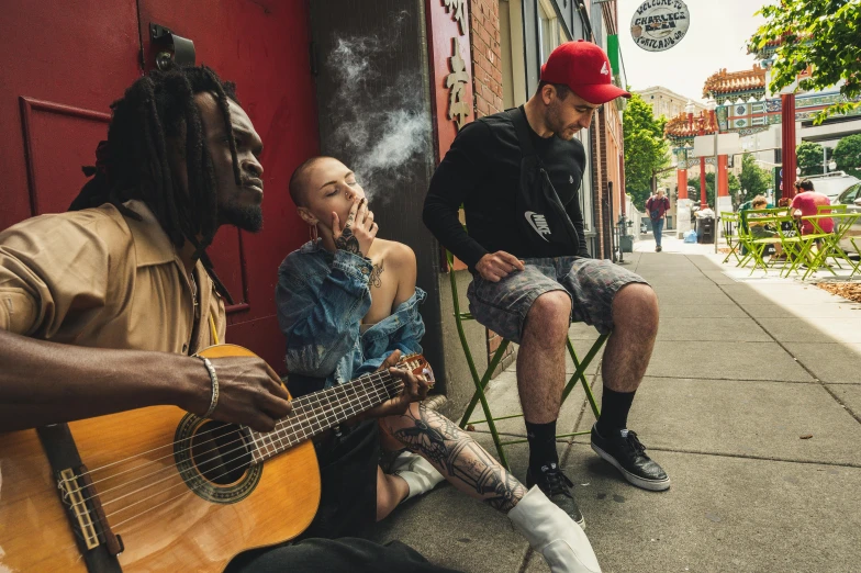 a group of men sitting next to each other on a sidewalk, pexels contest winner, renaissance, mac miller, musicians playing instruments, smoke in front, portrait of tall