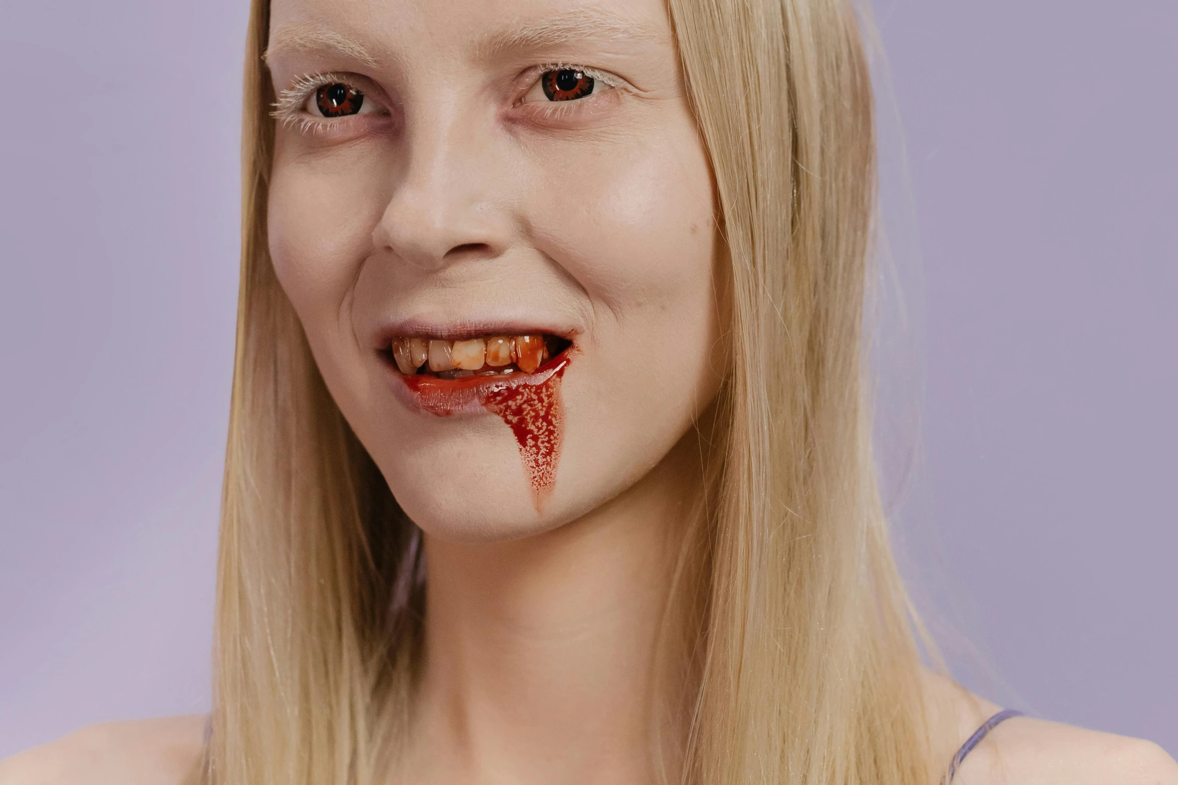 a woman with blood all over her face, trending on pexels, hyperrealism, helga pataki's teeth, ready to eat, yung lean, lizardlike tongue