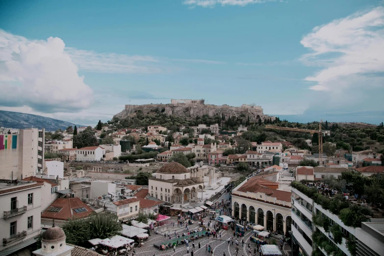 a view of a city with a hill in the background, pexels contest winner, neoclassicism, square, greek, thumbnail, high quality image