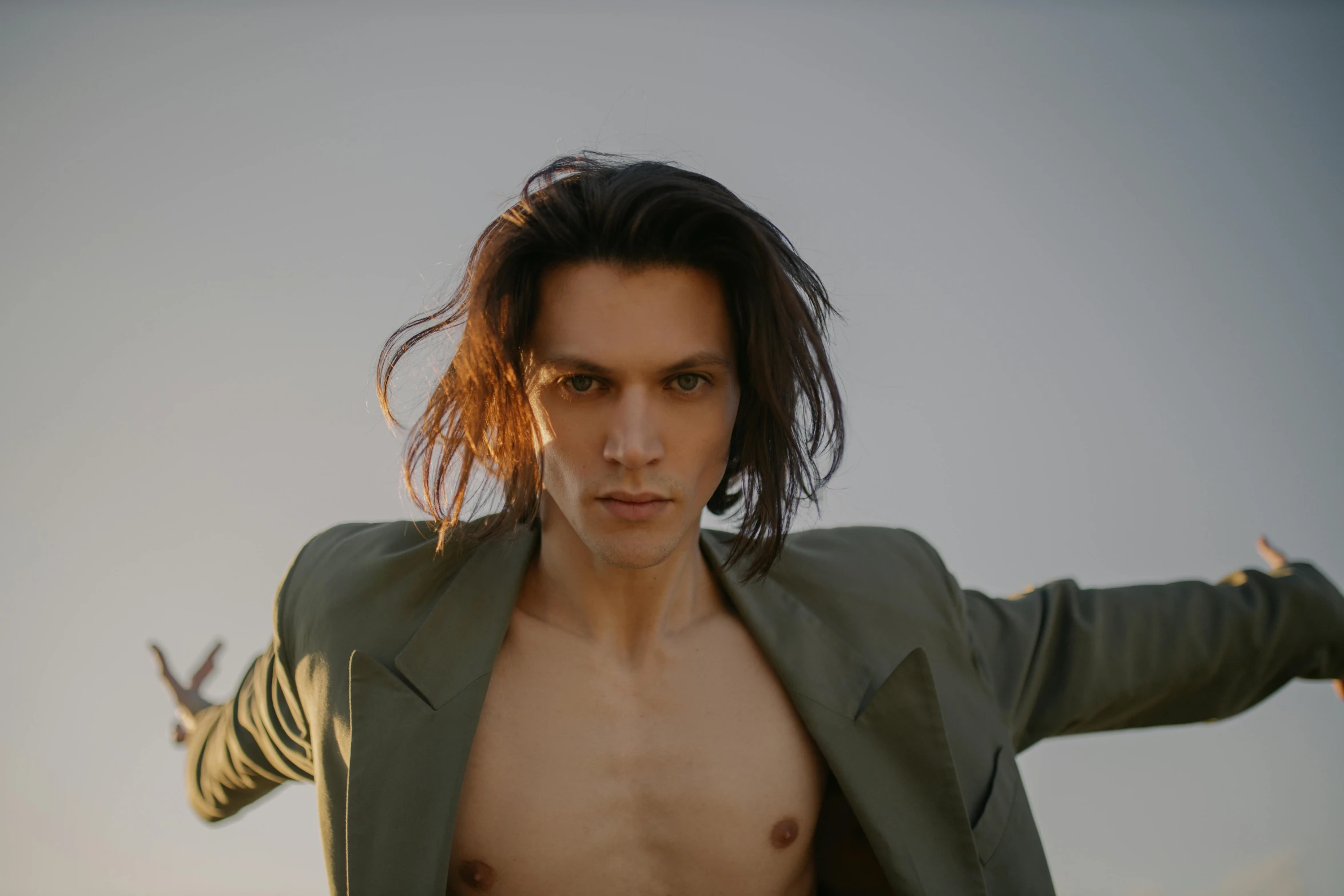 a close up of a person wearing a jacket, trending on pexels, bauhaus, shirtless, mid long hair, andrea savchenko, attractive androgynous humanoid