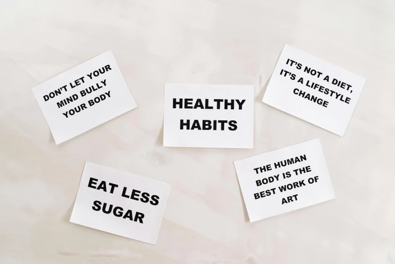 a bunch of stickers sitting on top of a table, a black and white photo, by Nina Hamnett, trending on pexels, hypermodernism, health bar hud, inspirational quote, set against a white background, placards