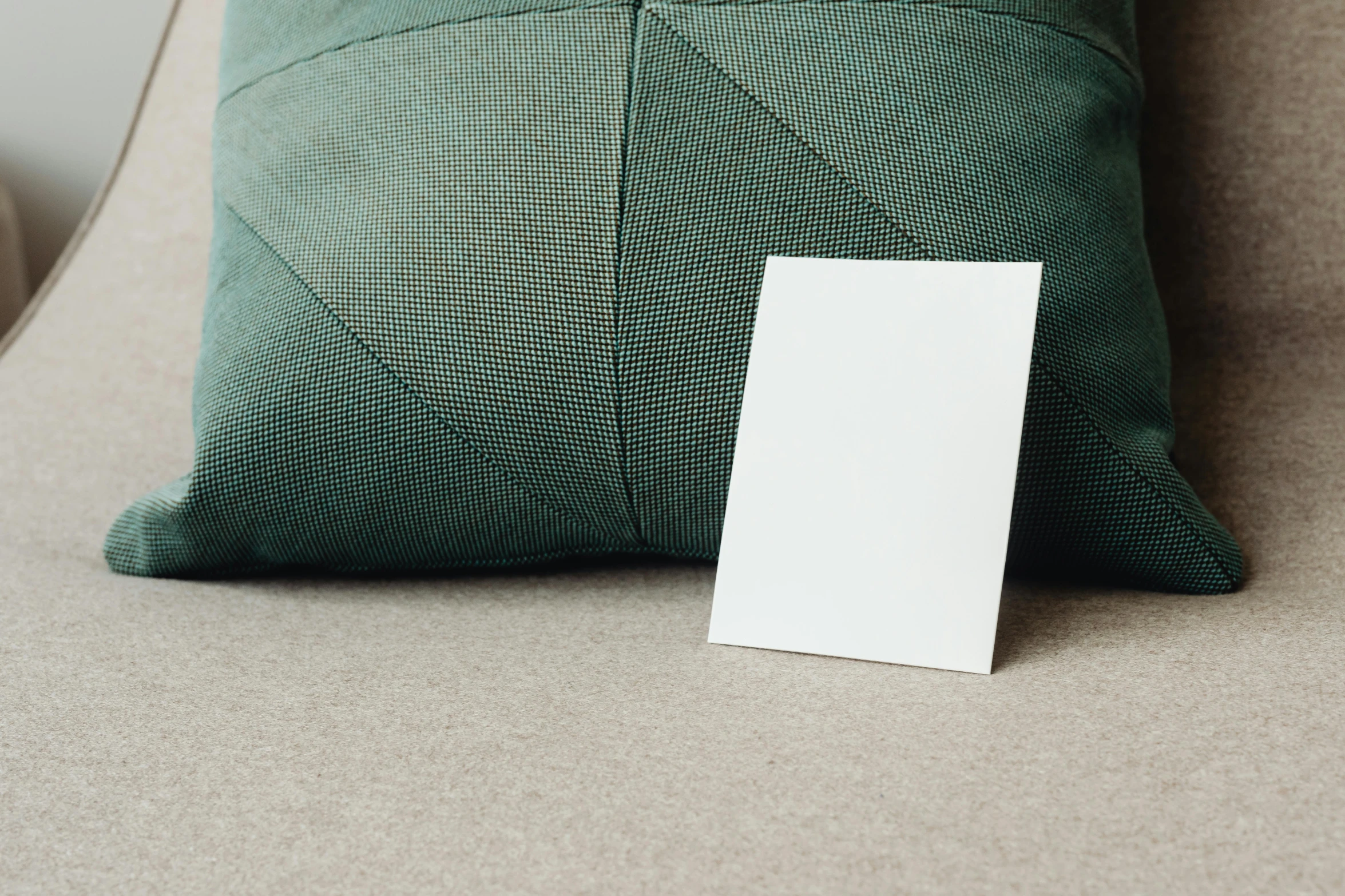 a blank card sitting on top of a green pillow, unsplash, square sticker, crisp image, gray canvas, ad image