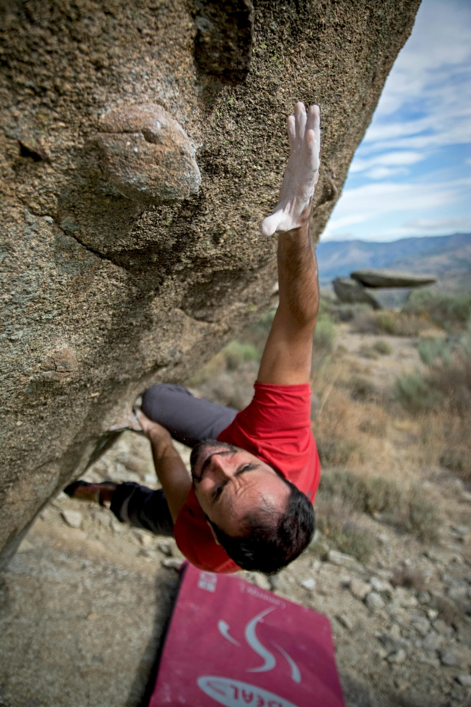 a man climbing up the side of a rock, a portrait, by Joe Stefanelli, arabesque, thumbnail, narrow shot, big hands, grain”