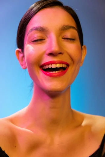a close up of a person with a cell phone, by Doug Ohlson, hyperrealism, perfect smile vogue, glowing with colored light, face like gal gadot, manically laughing