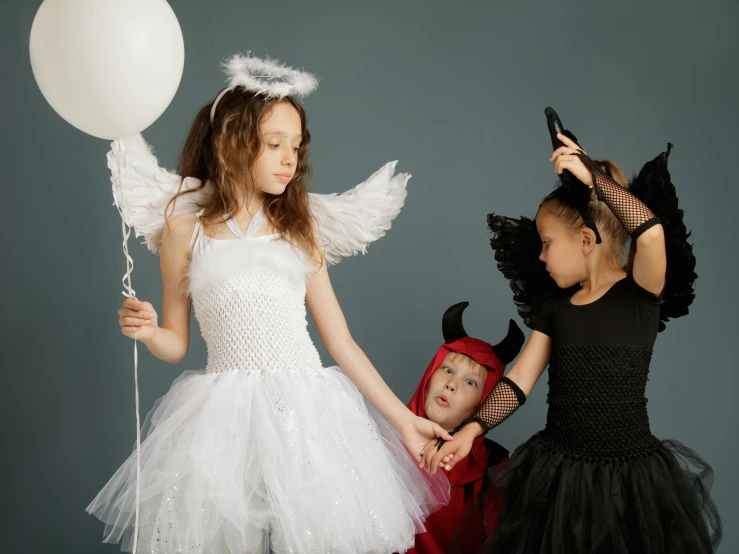 two little girls dressed up in halloween costumes, inspired by Gottfried Helnwein, pexels contest winner, with two pairs of wings, 15081959 21121991 01012000 4k, cupid, dressed in a beautiful
