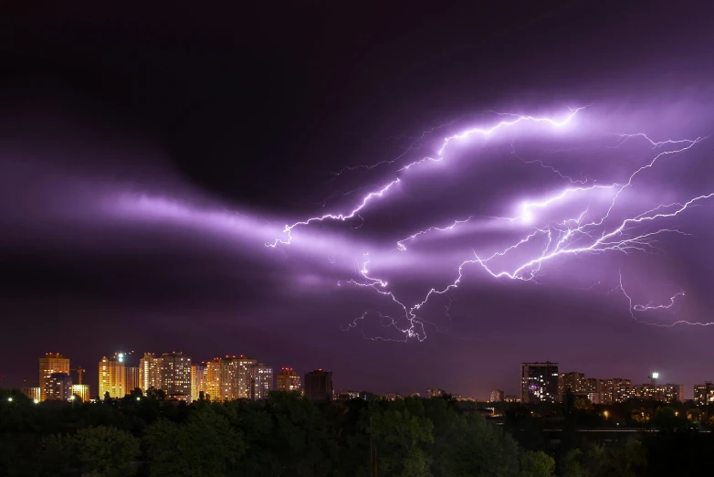 a lightning bolt over a city at night, by Adam Marczyński, pexels contest winner, shock art, purple. ambient lightning, alexey gurylev, lightning electricity coil, high detailed photo