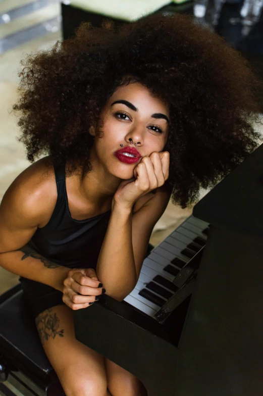 a beautiful young woman sitting at a piano, by Leo Michelson, trending on pexels, antipodeans, afro hair, pout, editorial image, large)}]