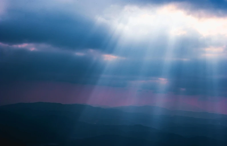 the sun shines through the clouds over the mountains, pexels contest winner, light and space, holy lights, multiple stories, heaven pink, dramatic blue light