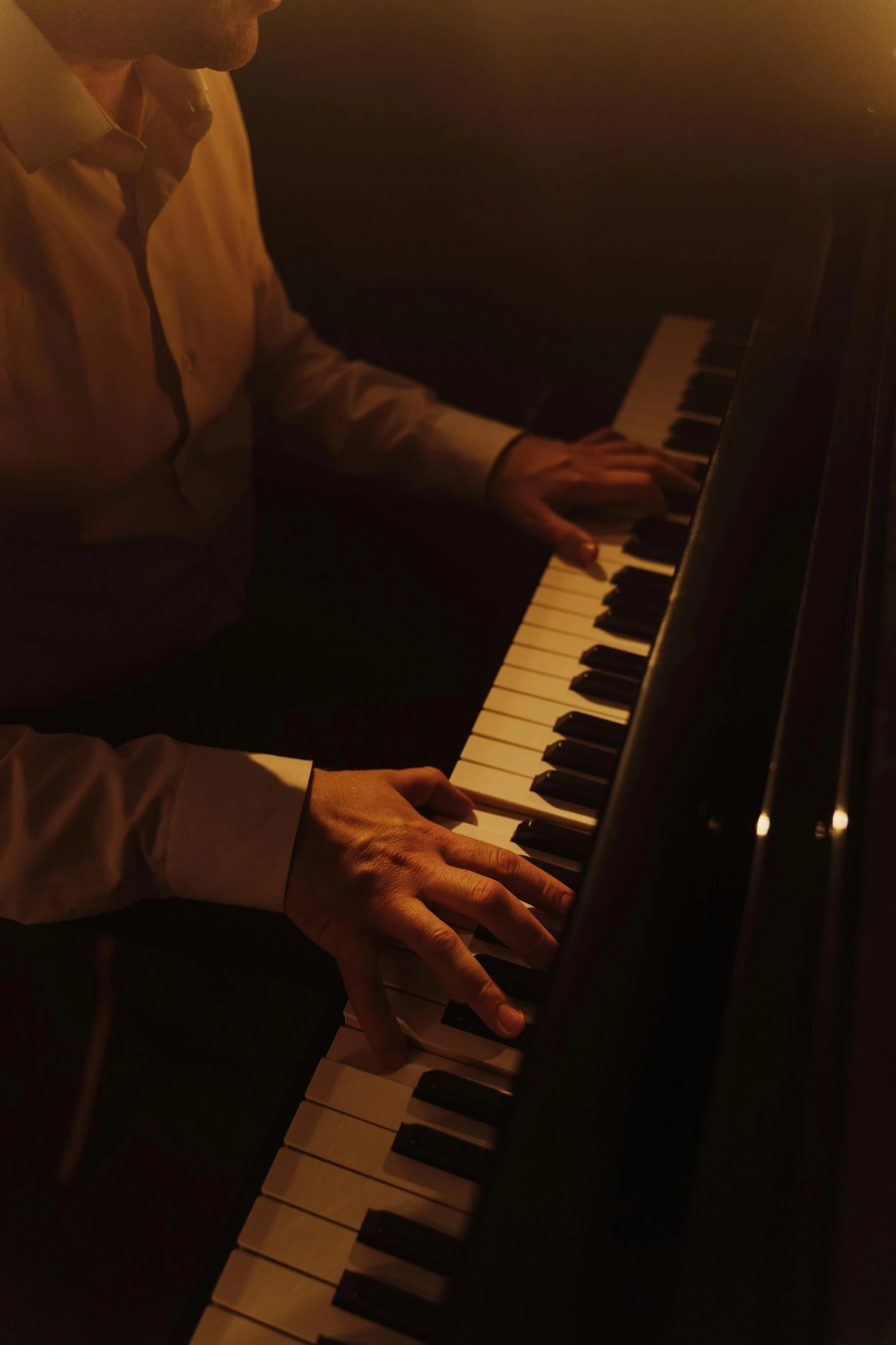 a man playing a piano in a dimly lit room, smooth in 8k, atmospheric”, cinematic shot ar 9:16 -n 6 -g, todd hido