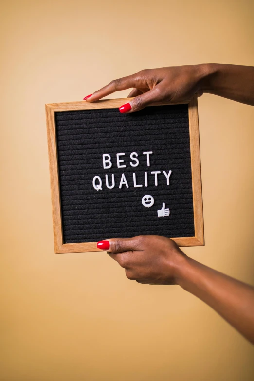 a woman holding a sign that says best quality, by Julia Pishtar, trending on unsplash, panel of black, giving a thumbs up, sustainable materials, 15081959 21121991 01012000 4k