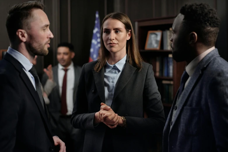 a woman shaking hands with a man in a suit, a portrait, inspired by Christen Dalsgaard, pexels contest winner, private press, courtroom scene, beautiful alison brie magician, worksafe. cinematic, looking serious