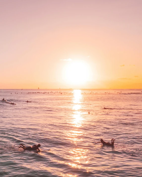 a group of people swimming in the ocean at sunset, by Robbie Trevino, happening, waikiki beach, vibrant aesthetic, manly, clear and sunny