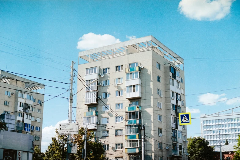 a tall white building sitting on the side of a road, unsplash, socialist realism, soviet apartment building, 2000s photo, 000 — википедия, hyperrealism photography