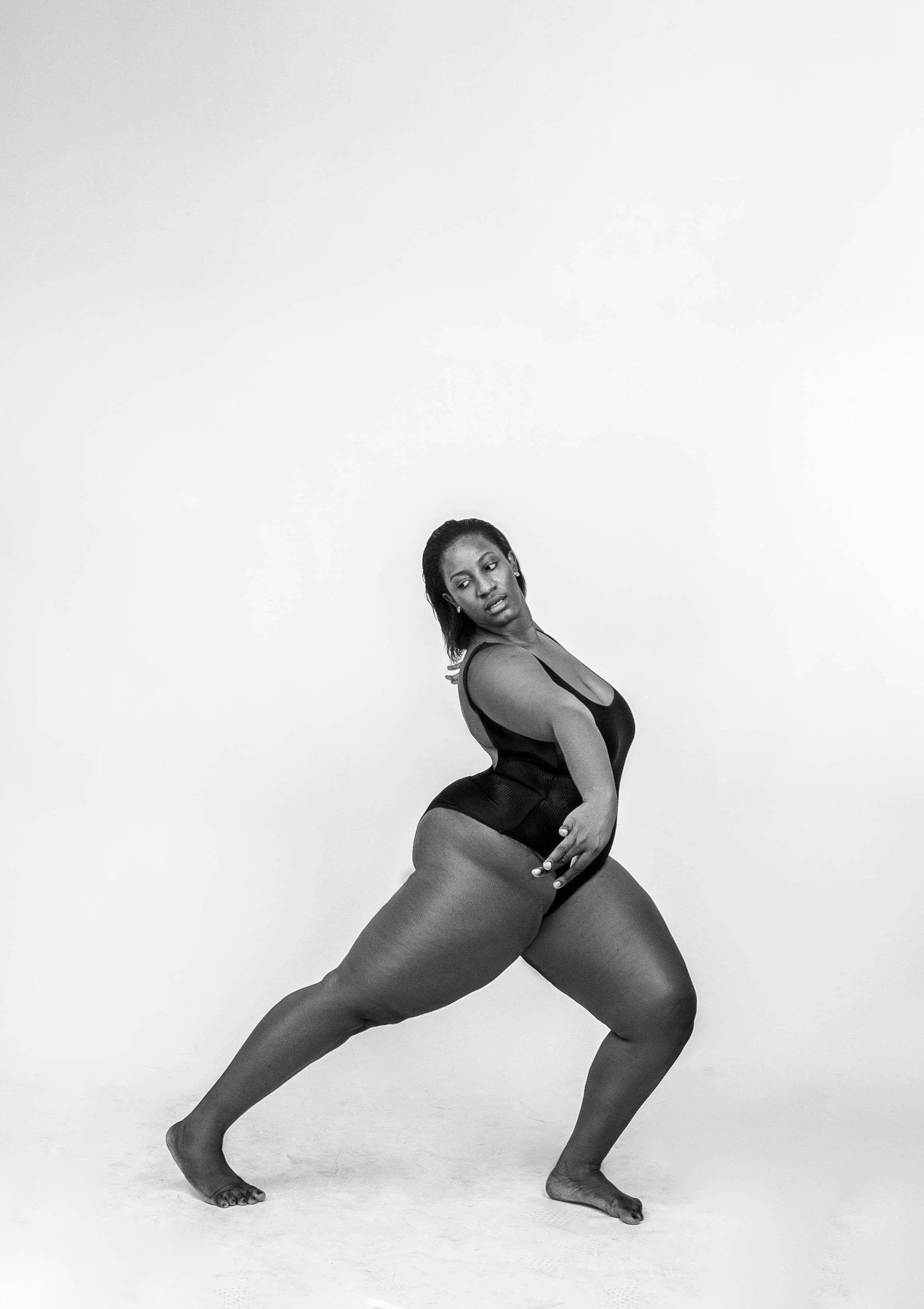 a black and white photo of a woman in a leo leo leo leo leo leo leo leo leo leo leo leo leo leo leo, by Sam Charles, plus-sized, pointe pose, black woman, thicc