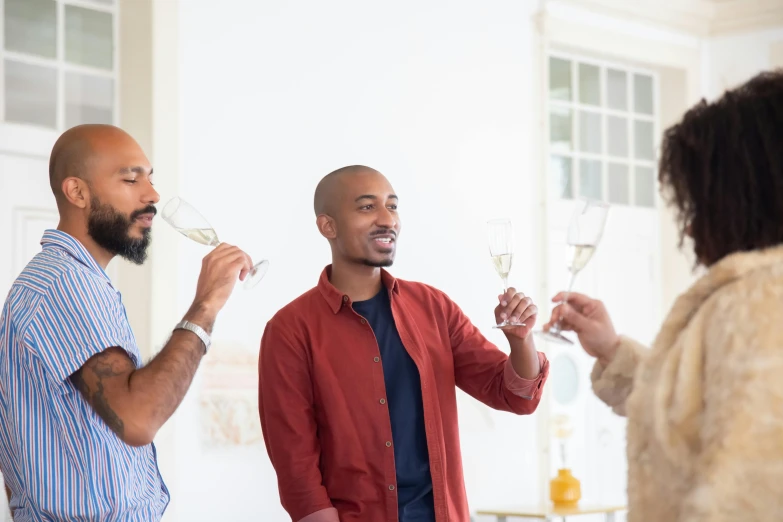 a couple of men standing next to each other holding wine glasses, pexels contest winner, renaissance, jeffrey wright, cheers, varying ethnicities, slightly minimal
