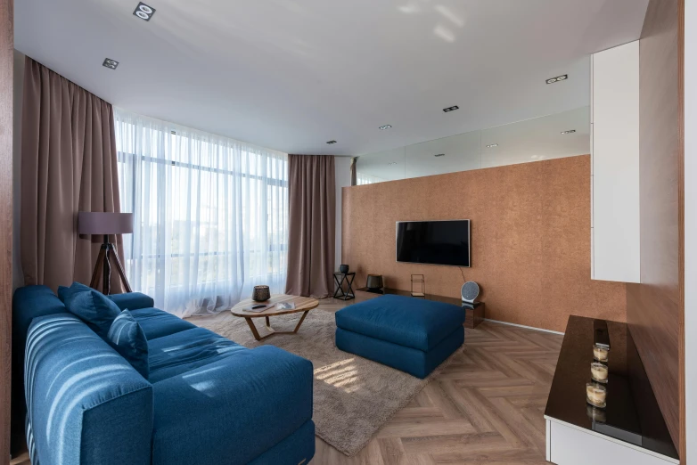 a living room filled with furniture and a flat screen tv, by Adam Marczyński, unsplash, brown and cyan blue color scheme, floor - to - ceiling windows, located in hajibektash complex, thumbnail