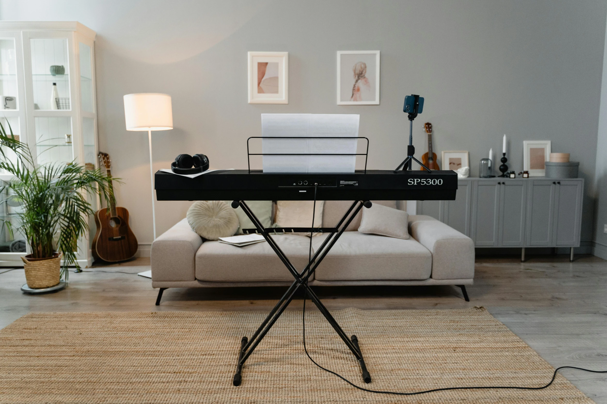 a keyboard sitting on top of a table in a living room, an album cover, inspired by Simon Gaon, unsplash, super model-s 100, full front view, live performance, brook