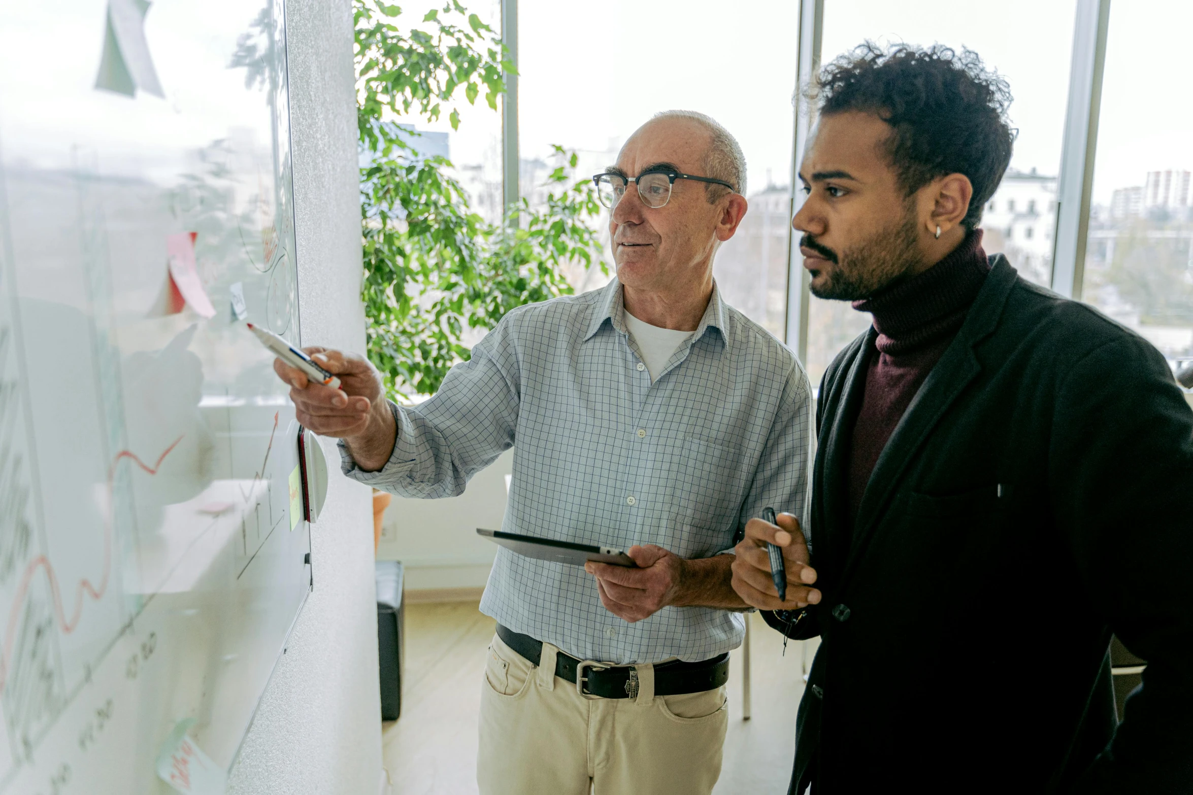 two men standing next to each other in front of a whiteboard, by William Berra, pexels contest winner, mc escher and ronny khalil, overlooking, older male, planning