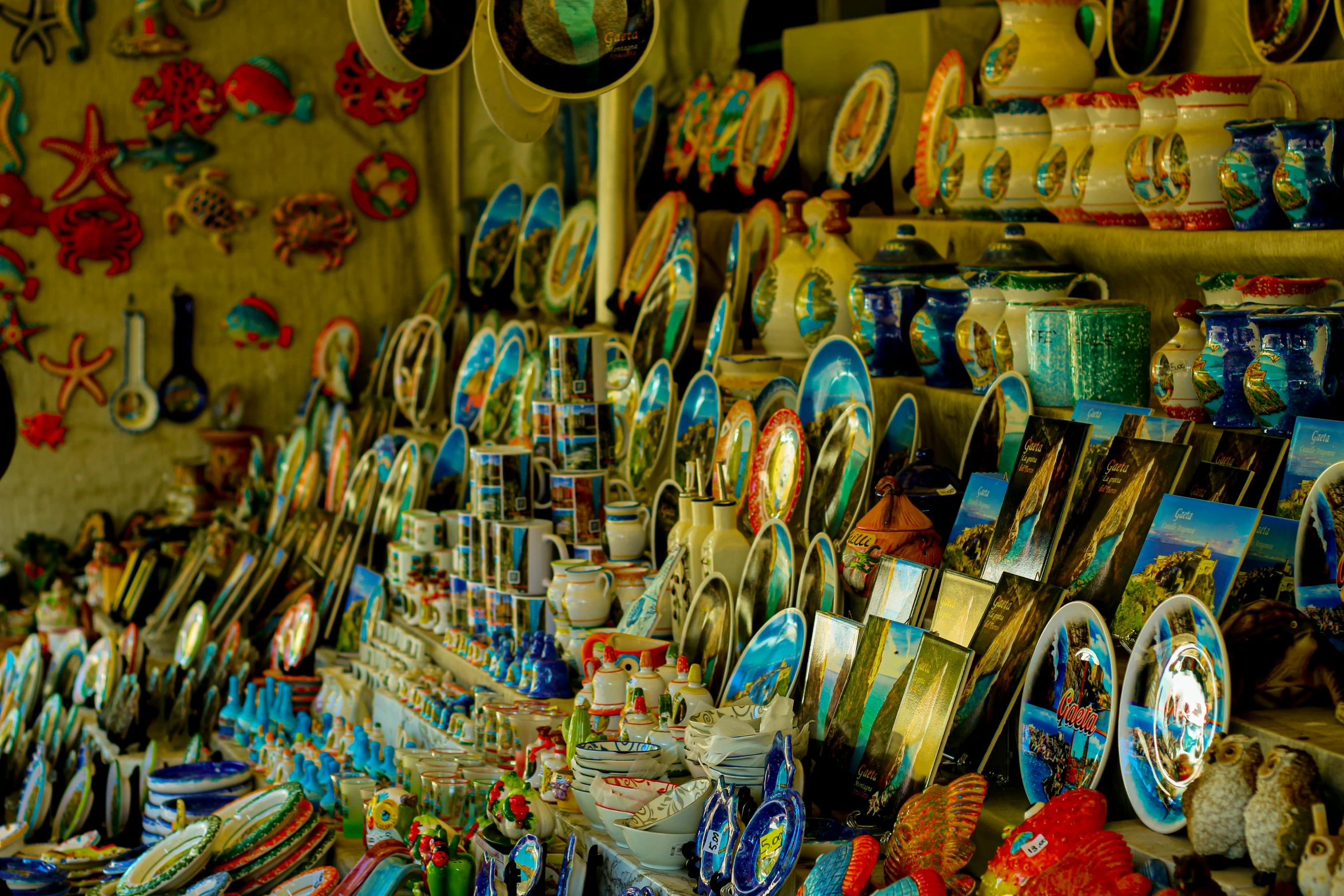 a store filled with lots of assorted items, a still life, pexels contest winner, maximalism, colorful ancient egyptian city, plates, shore, postprocessed