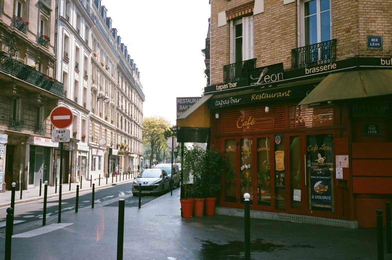 a city street filled with lots of tall buildings, a photo, unsplash, paris school, storefront, 2000s photo, 🦩🪐🐞👩🏻🦳, diner caffee