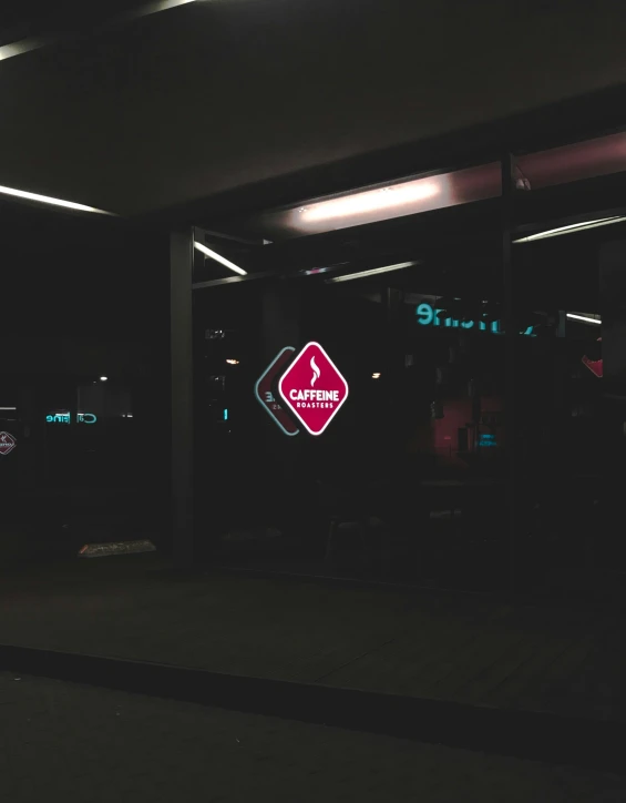 a couple of signs that are on the side of a building, by Jacob Toorenvliet, trending on unsplash, standing in a dimly lit room, gas station, profile image, low quality photo