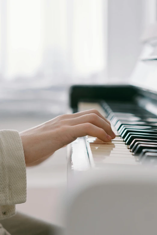 a close up of a person playing a piano