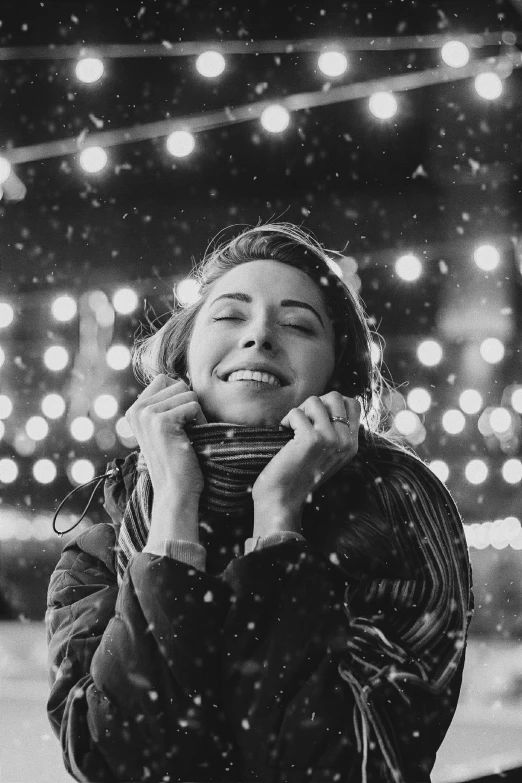 a black and white photo of a woman in the snow, pexels contest winner, realism, beautiful glowing lights, smile 1950s, valentina remenar, happy expressions