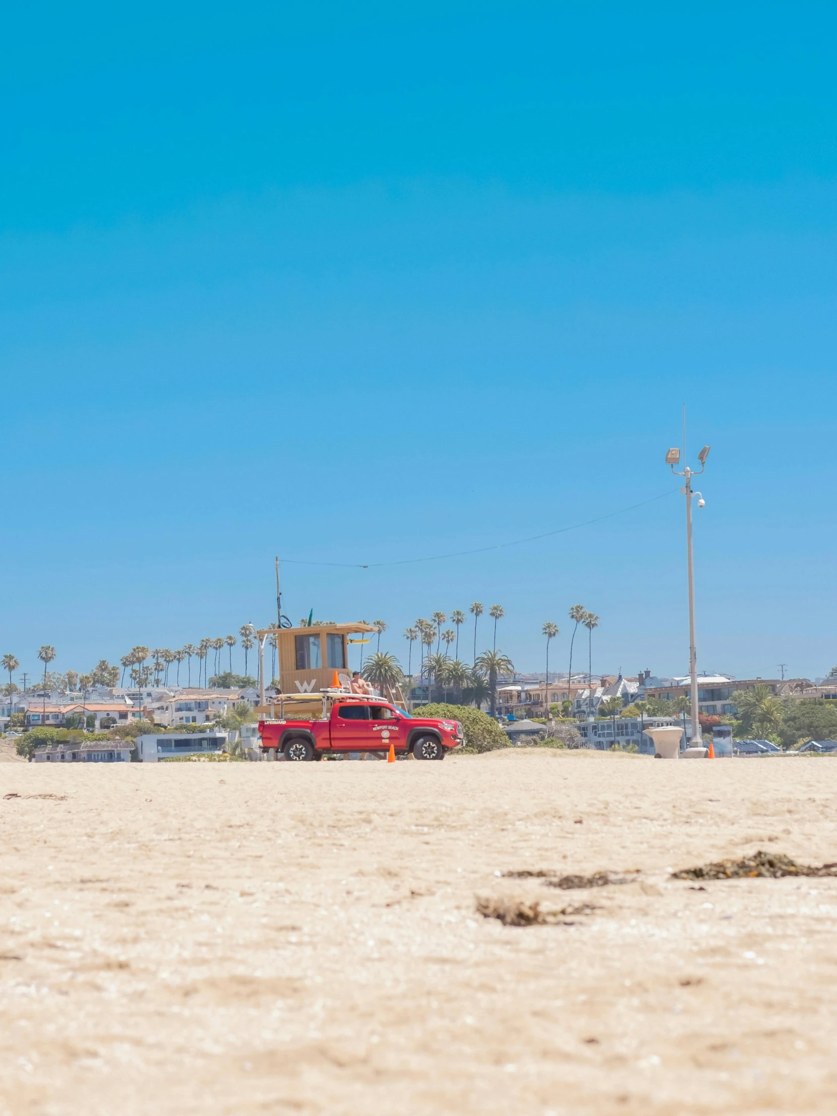 a red truck parked on top of a sandy beach, los angelos, today\'s featured photograph 4k, summer vibes, square