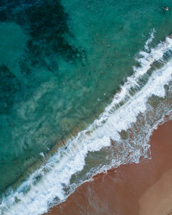 a group of people riding surfboards on top of a sandy beach, birds eye photograph, teal orange color palette 8k, thumbnail, wall of water either side