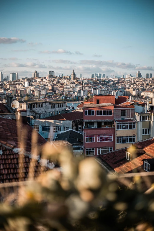 a view of a city from the top of a hill, by Cafer Bater, pexels contest winner, fallout style istanbul, tiled roofs, background image, low-angle shot