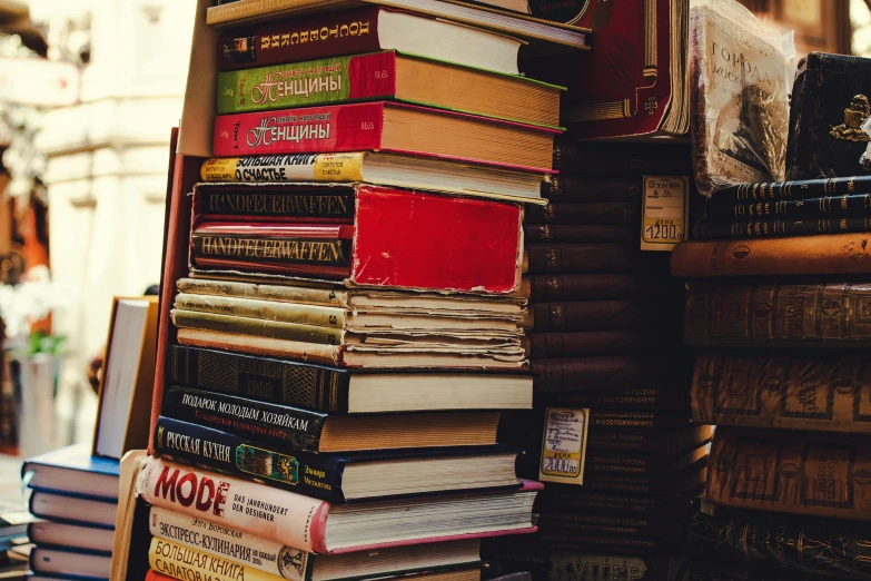 a stack of books sitting on top of a table, cluttered, bookshops, retro vibe, instagram post