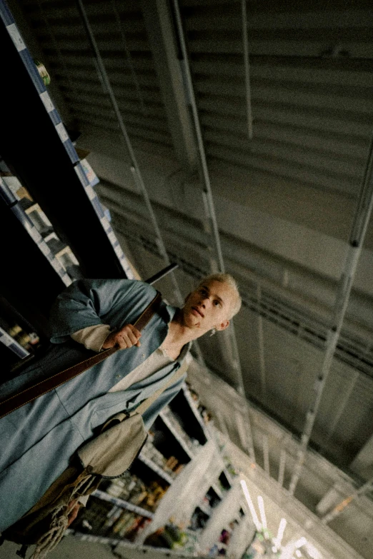 a man in a suit and tie standing in a warehouse, unsplash, hyperrealism, jim jarmusch, mr clean, as she looks up at the ceiling, mechanic