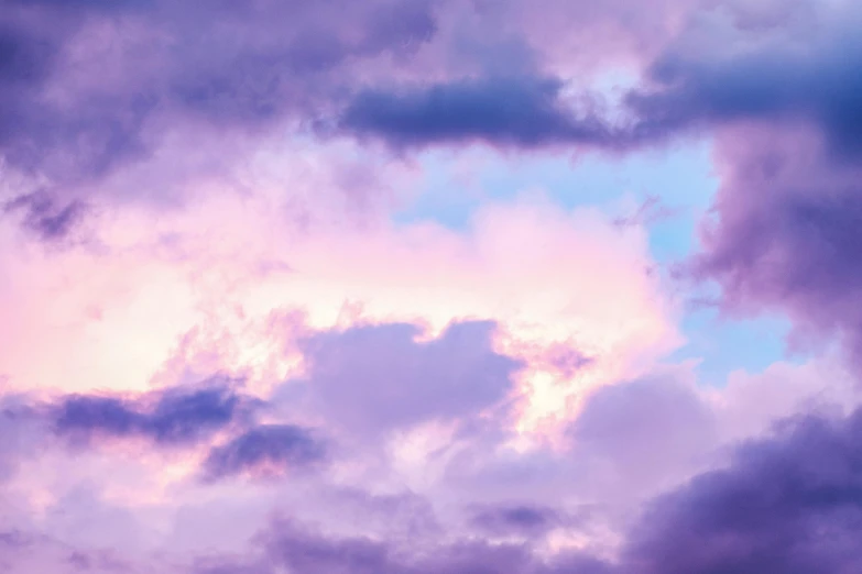 a plane is flying through a cloudy sky, an album cover, by Carey Morris, unsplash, romanticism, purple and pink, cloud iridescence, early evening, pastel overflow