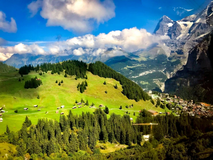a view of a valley with a mountain in the background, by Daniel Seghers, pexels contest winner, renaissance, lauterbrunnen valley, slide show, hd footage, lush green