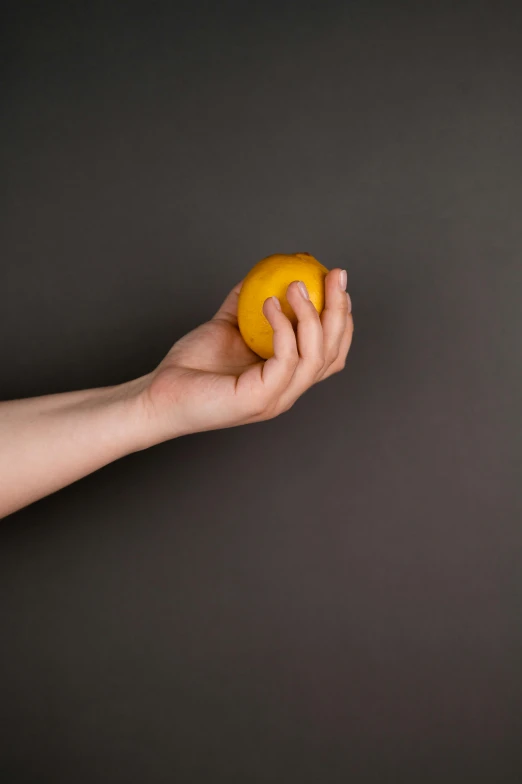 a person holding an orange in their hand, by Matthias Stom, minimalism, square, 15081959 21121991 01012000 4k, manicured, shy