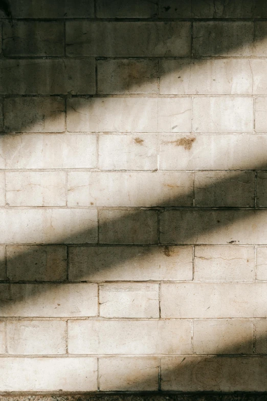 a fire hydrant in front of a brick wall, pexels contest winner, light and space, shadow gradient, made of concrete, square lines, photograph from above