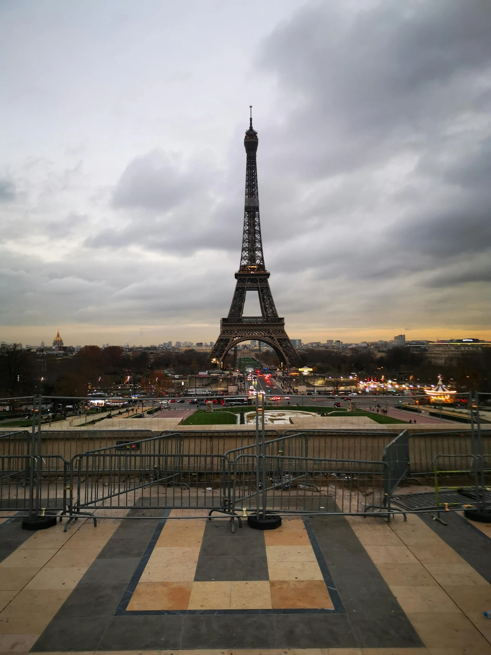 a view of the eiffel tower from the top of the eiffel tower, an album cover, by Daniel Gelon, pexels contest winner, grey skies, evening lights, 3/4 front view, unedited