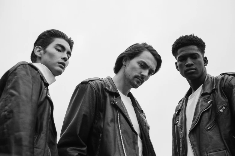 three men in leather jackets standing next to each other, a black and white photo, by Dean Ellis, pexels, bauhaus, young handsome pale roma, three futuristic princes, wearing off - white style, photo in style of tyler mitchell