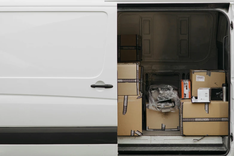 a white van with a bunch of boxes in the back, a portrait, unsplash, hyperrealism, image split in half, half and half, detailed product shot, multi-part