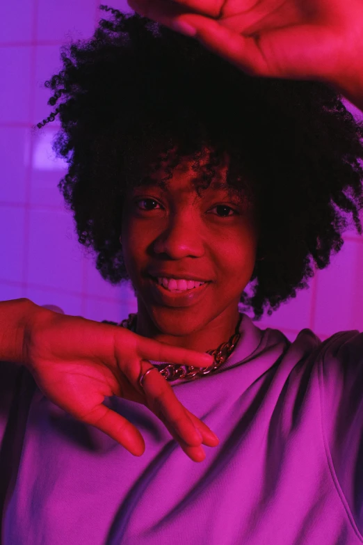 a woman making a heart sign with her hands, an album cover, by Cosmo Alexander, pexels contest winner, black teenage boy, ((purple)), glow up, nugget