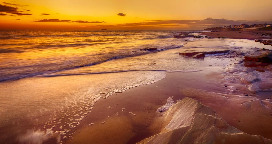 a large body of water sitting on top of a sandy beach, by Julian Allen, pexels contest winner, sunrise colors, “ iron bark, liquid gold, slide show